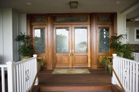 Floral glass paned front door with doormat