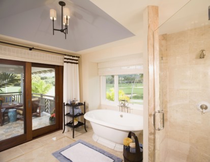 Contemporary bathroom with pocket doors to patio
