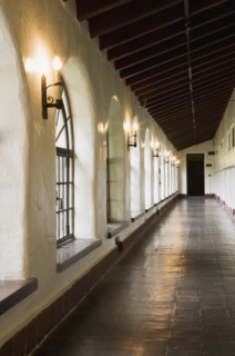 Row of windows down old hallway