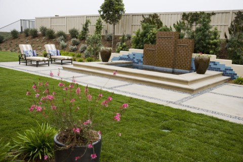 Back patio with contemporary fountain
