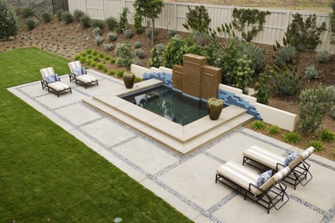 Back patio with contemporary fountain