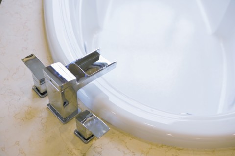 Contemporary faucet above bathtub