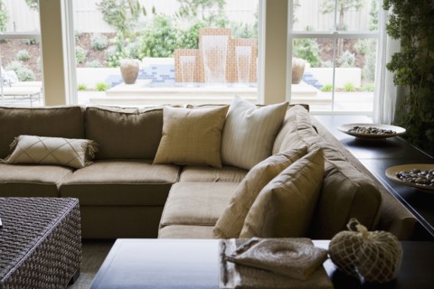 Sectional sofa in front of windows