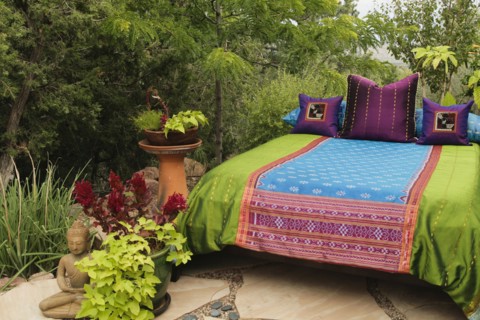 Colorful bedding on outdoor bed