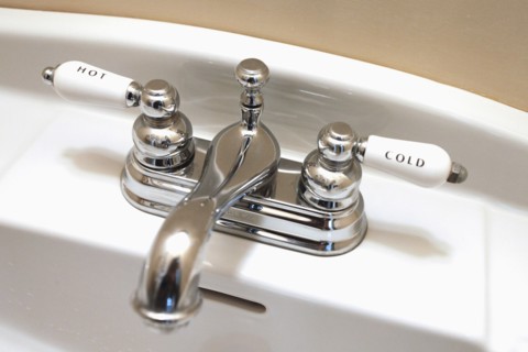 Detail faucet labeled hot and cold