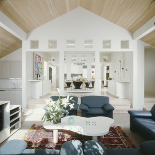 View from living area into dining and then kitchen beyond