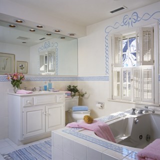 Stenciled bathroom from tub to vanity area