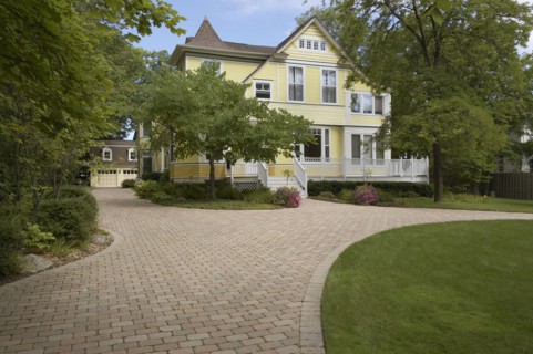 Yellow clapboard Victorian with white trim