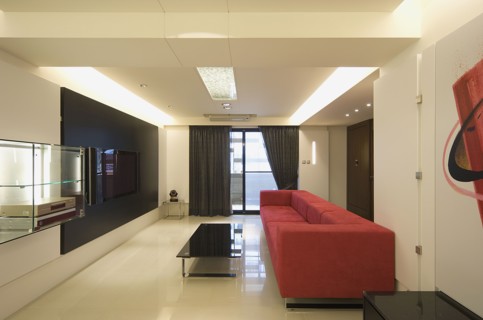 Modern living room with red sofa