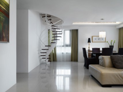 Living room and dining room with spiral staircase in corner