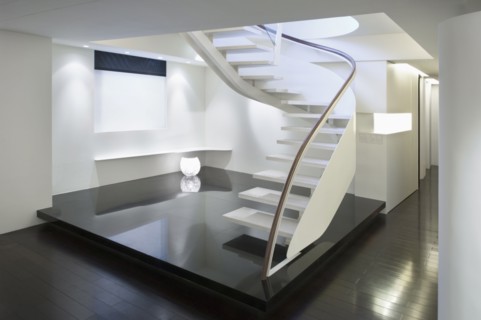 Modern white staircase with glass banister