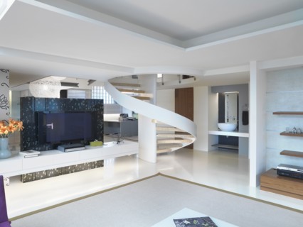 Modern winding staircase and television