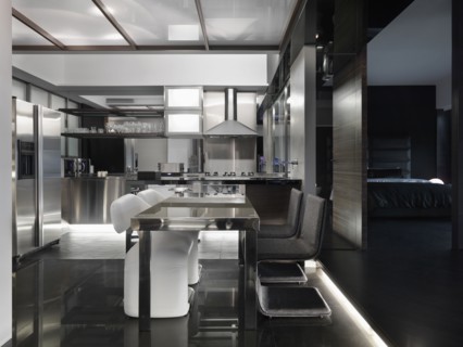 Modern black and white kitchen and dining area