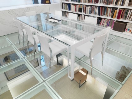 Glass conference table in room with glass floor