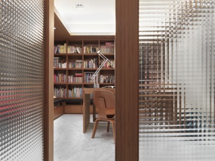 Open translucent doors leading to modern home office