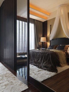 Reflection of master bedroom in mirror