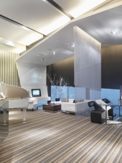 Modern living and dining room separated by string curtain