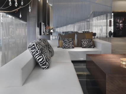 Large modern sectional sofa with animal print throw pillows