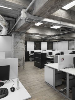 Modern industrial office with rows of computers