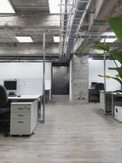 Modern industrial office with rows of computers