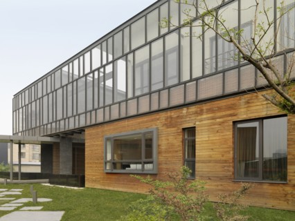 Exterior view multiple story modern home with hardwood siding