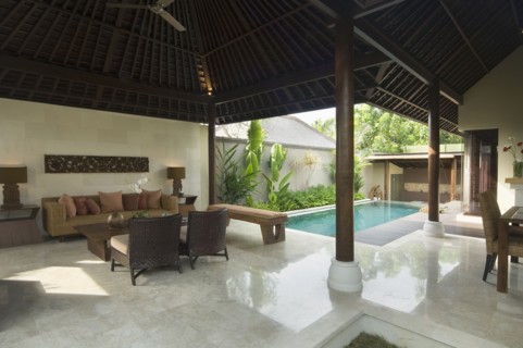 Contemporary sitting area opened up to private pool
