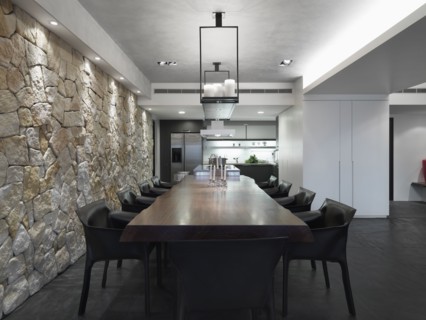 Modern dining room with long wooden table