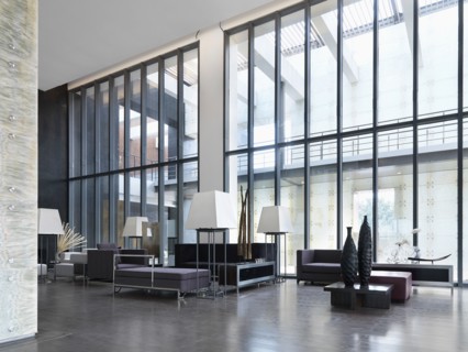 Sitting area with high ceilings and modern furniture