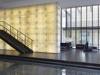 Modern staircase in front of illuminated wall