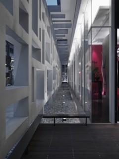 Landscape lighting in stones along modern building