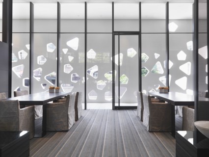 Floor to ceiling windows in modern dining room