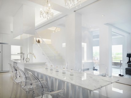 Marble dining table with clear plastic chairs