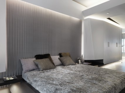 Modern platform bed with fur comforter