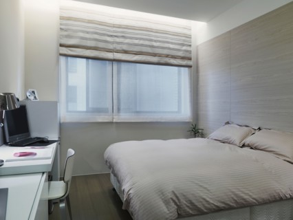 Small modern bedroom with desk