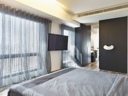 Large window in modern bedroom