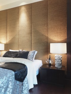 Textured wall behind bed