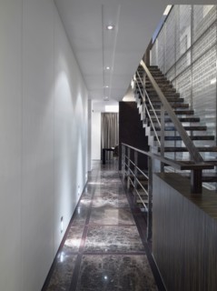 Hallway along staircase in modern home