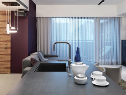 View down kitchen island to living room
