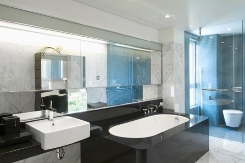 Black bathtub in modern marble bathroom