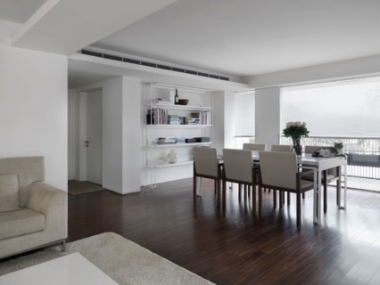 Dining room table in front of large windows