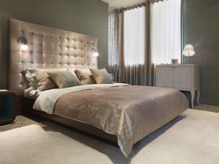 Lamps built in to headboard of modern bed