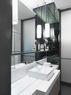 White bathroom sink on white countertop
