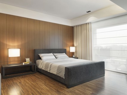 Gray striped bedding on bed in modern bedroom
