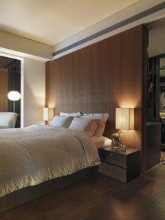 Dark bedroom illuminated by lamps