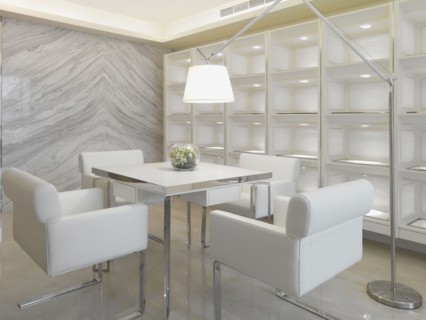 Square dining table and reading light in white modern home