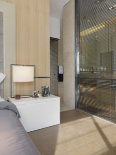 Bed and nightstand in bedroom with hardwood floor