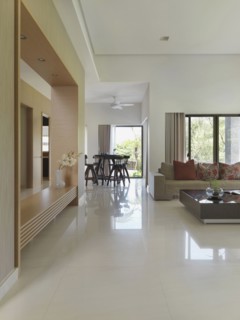 View through living room in modern home to dining area