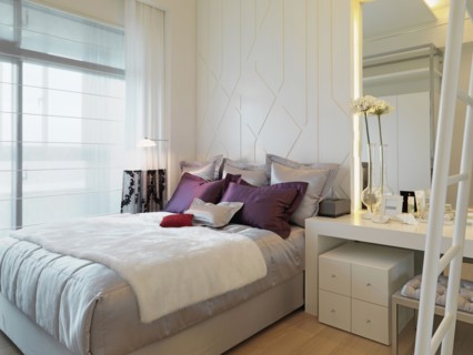Elegant bed in modern bedroom