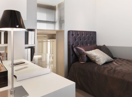 Small modern bedroom with desk