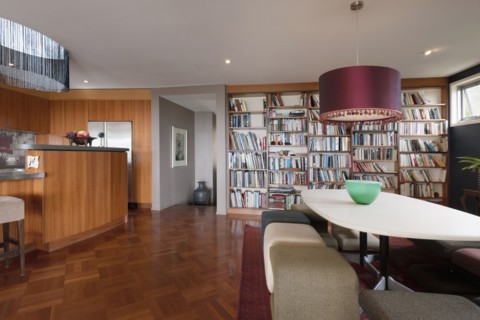 Dining area and library in contemporary house
